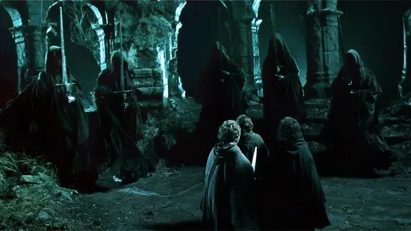 A dark, menacing scene from The Lord of the Rings on Weathertop, where the nine black-robed Ringwraiths have cornered and surrounded the small, vulnerable hobbits.