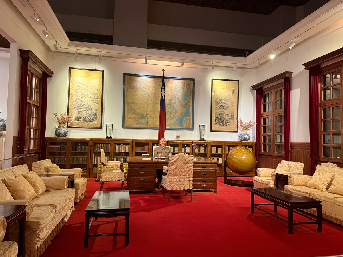 Wax figure of Chiang Kai-shek in his presidential office at the memorial hall, depicting strategic leadership during Taiwan's formative years.